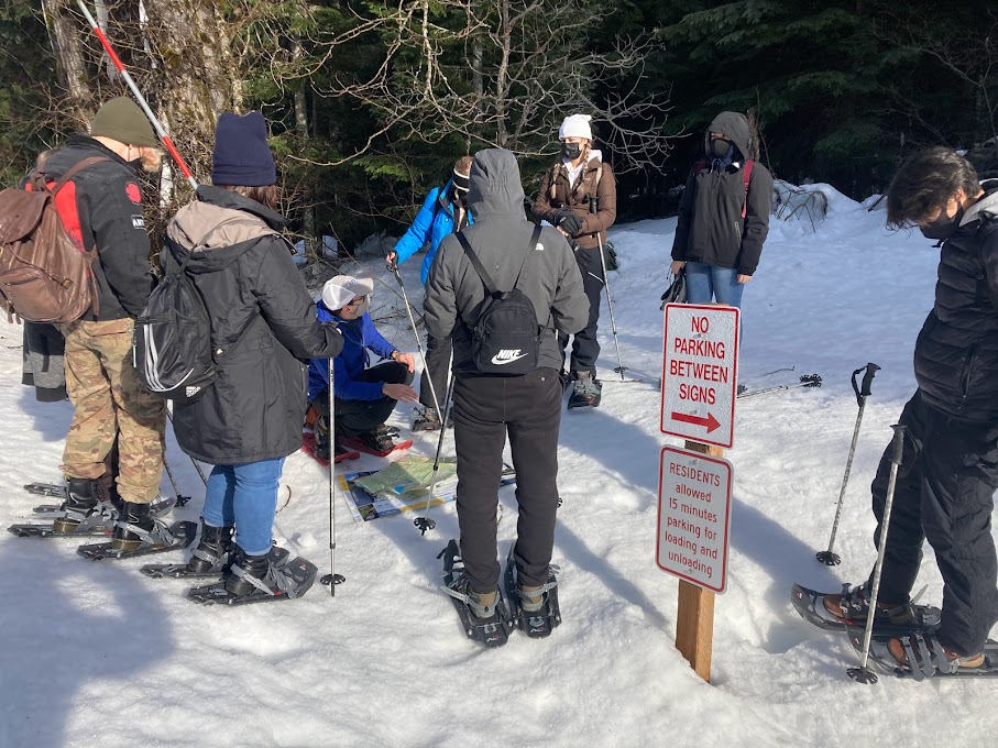 Students circled up with a map learning about Snoqualmie Pass